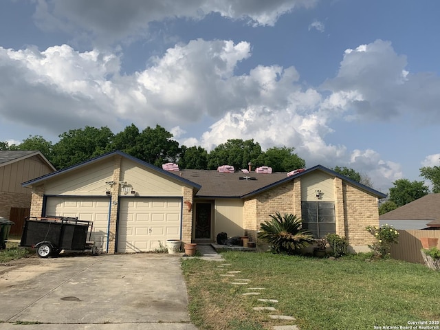 ranch-style home with a garage and a front lawn