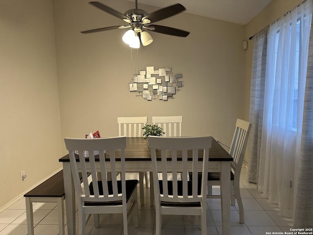 dining area featuring light tile patterned flooring and ceiling fan