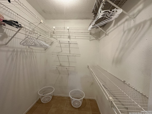 walk in closet featuring tile patterned floors