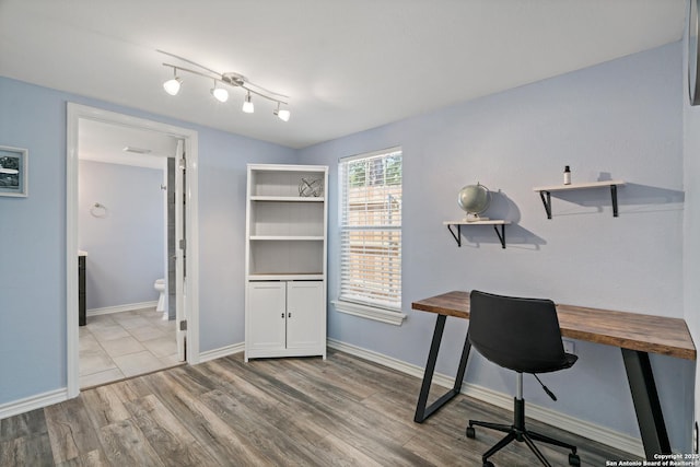 home office featuring light hardwood / wood-style floors