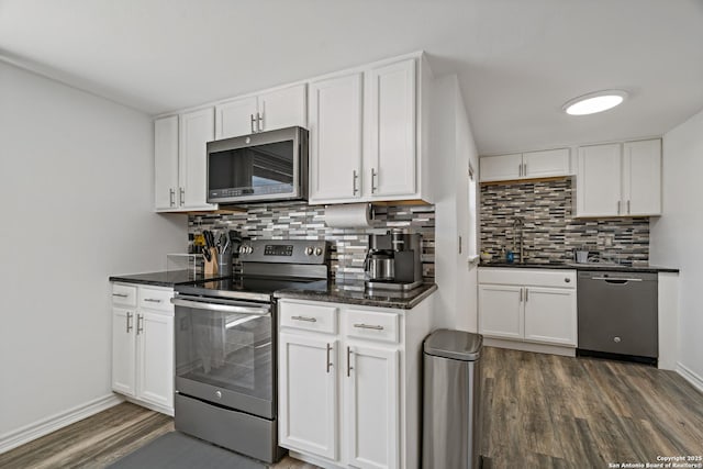 kitchen featuring white cabinets and appliances with stainless steel finishes