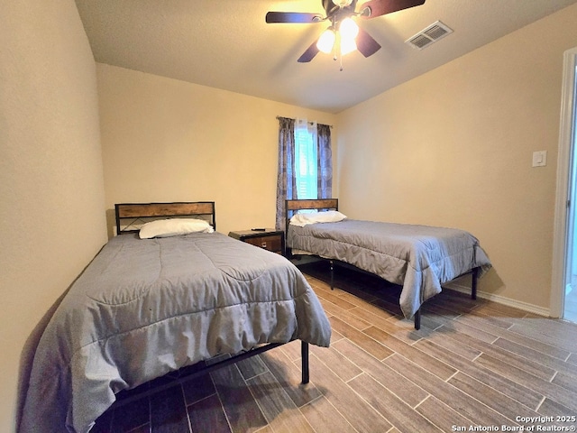 bedroom with hardwood / wood-style flooring and ceiling fan