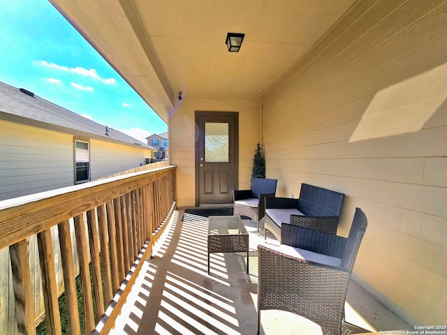 balcony with an outdoor hangout area