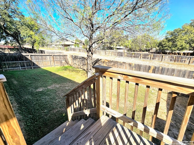 wooden terrace with a yard