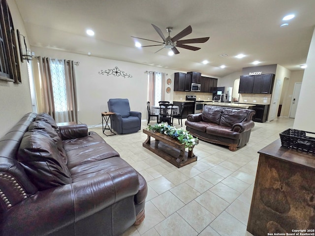 tiled living room with ceiling fan