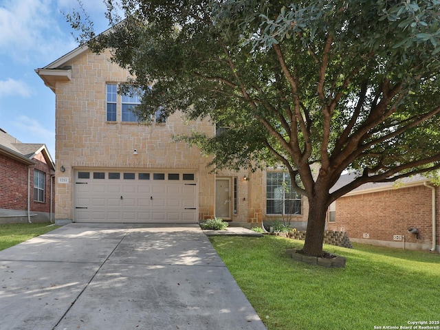 view of front of home featuring a garage and a front lawn