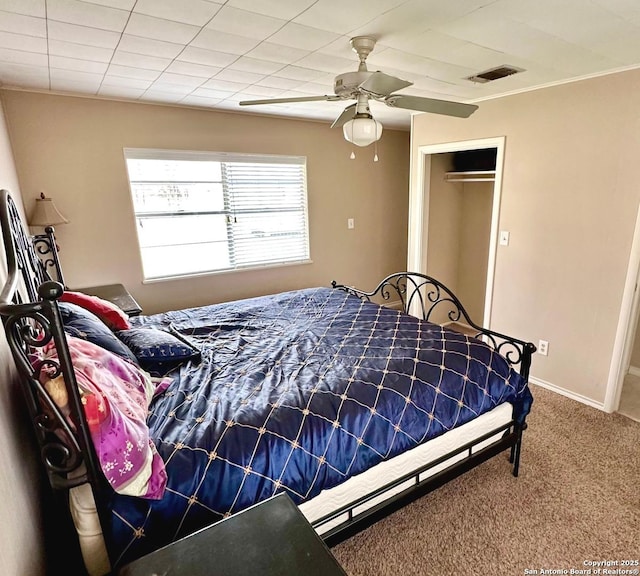 bedroom featuring carpet flooring, ceiling fan, and a closet