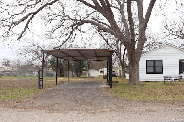 exterior space with a carport