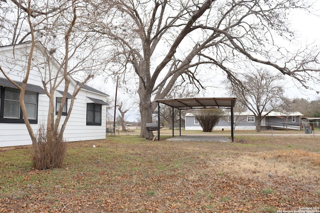 view of yard with a carport