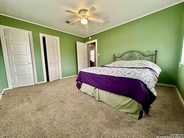 carpeted bedroom with crown molding and ceiling fan