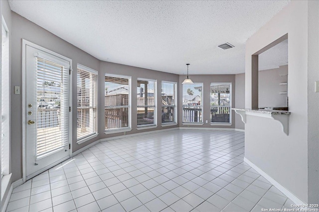 interior space featuring a textured ceiling