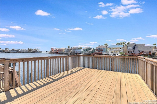 wooden deck featuring a water view