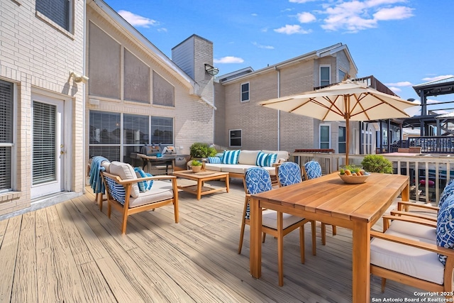 wooden deck featuring an outdoor hangout area