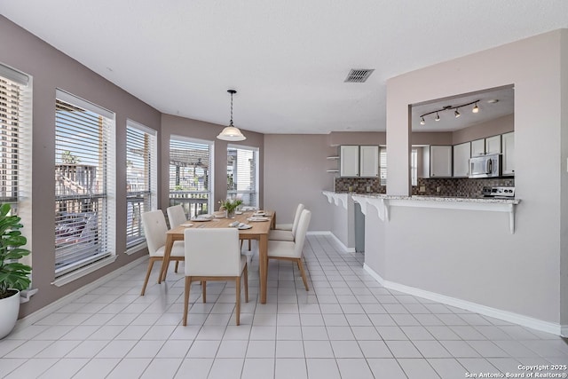 dining room featuring light tile patterned floors