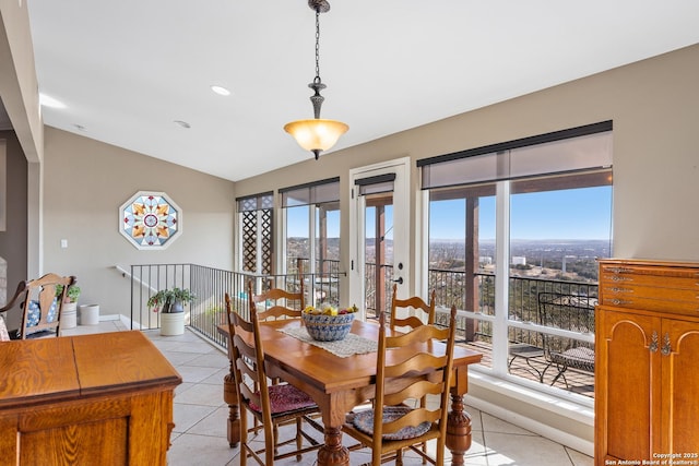 dining area featuring light tile patterned floors and a wealth of natural light