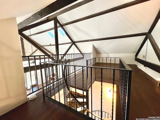 interior space featuring hardwood / wood-style flooring and vaulted ceiling