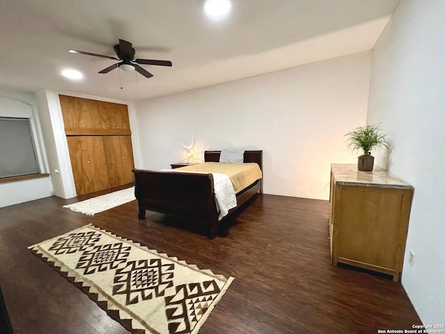 bedroom featuring dark wood-type flooring and ceiling fan