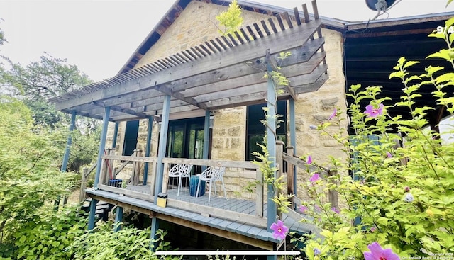 wooden terrace with a pergola