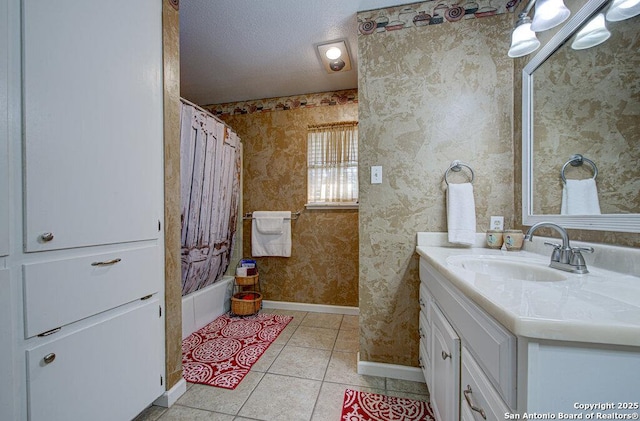 bathroom featuring vanity, tile patterned floors, a textured ceiling, and shower / tub combo with curtain