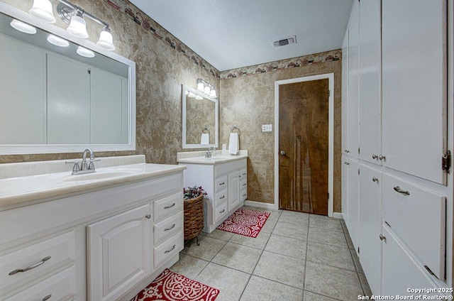 bathroom with vanity and tile patterned floors