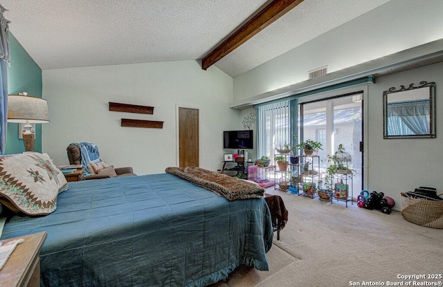 carpeted bedroom with a textured ceiling and vaulted ceiling with beams