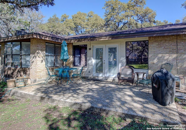 back of house featuring a patio area and french doors