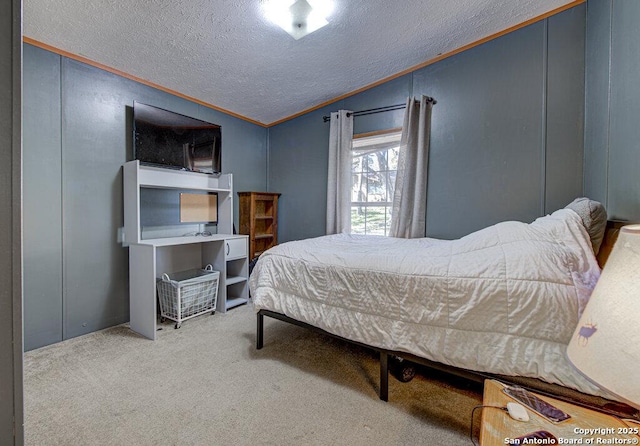 bedroom featuring lofted ceiling, crown molding, a textured ceiling, and carpet