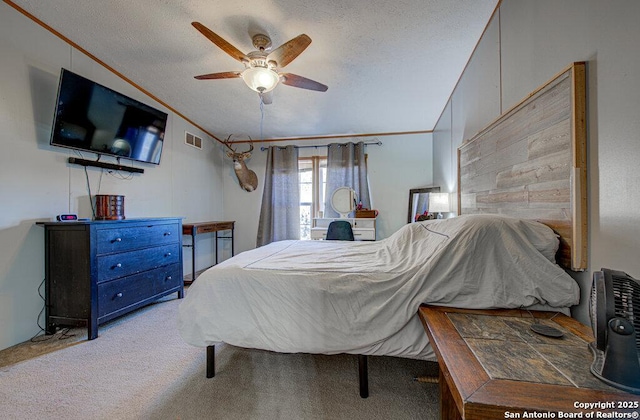 bedroom featuring lofted ceiling, a textured ceiling, and ceiling fan