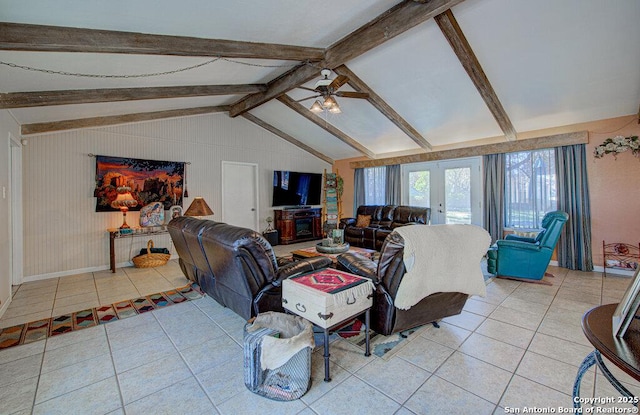 tiled living room featuring lofted ceiling with beams, ceiling fan, and french doors