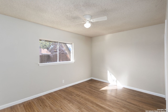 unfurnished room featuring ceiling fan, hardwood / wood-style floors, and a textured ceiling