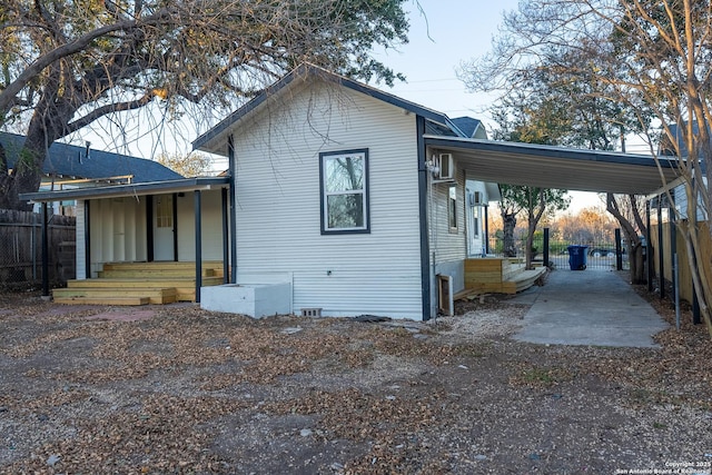 view of side of property featuring a carport