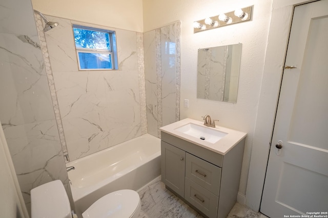 full bathroom with tiled shower / bath, vanity, and toilet