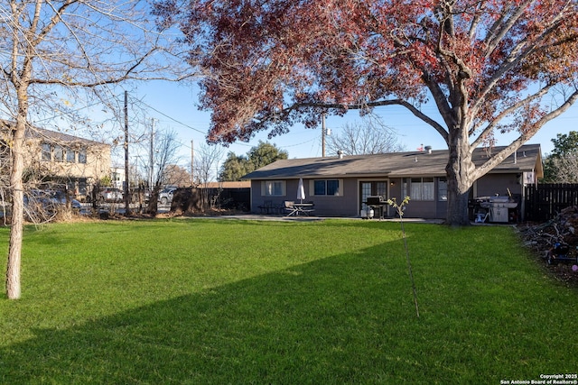 view of yard with fence and a patio