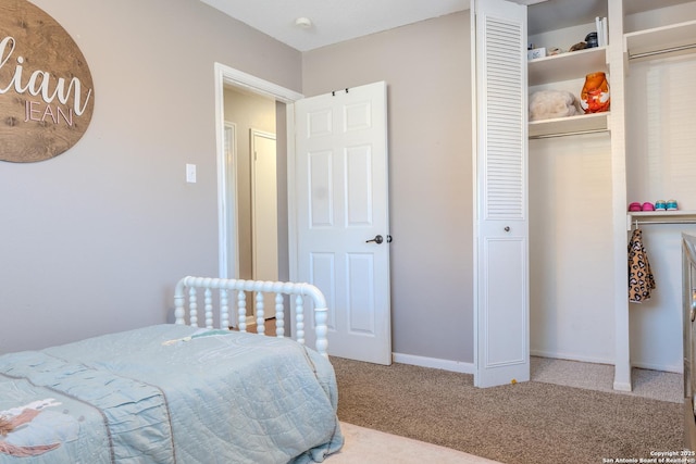 carpeted bedroom with a closet