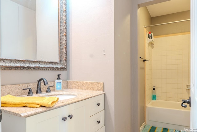 bathroom with shower / bathing tub combination and vanity