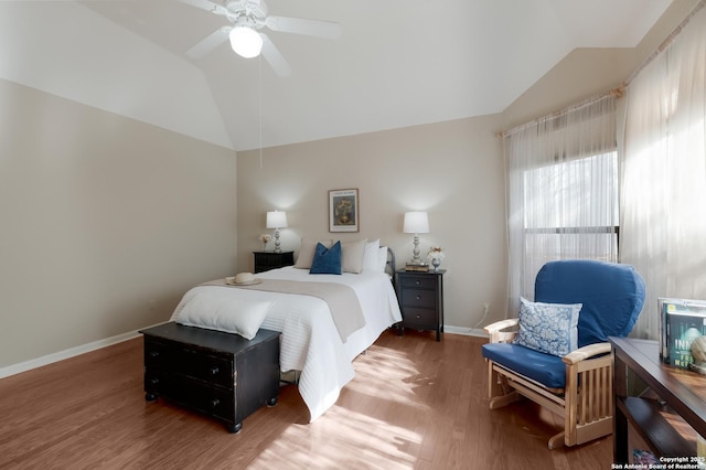 bedroom with lofted ceiling, hardwood / wood-style flooring, and ceiling fan