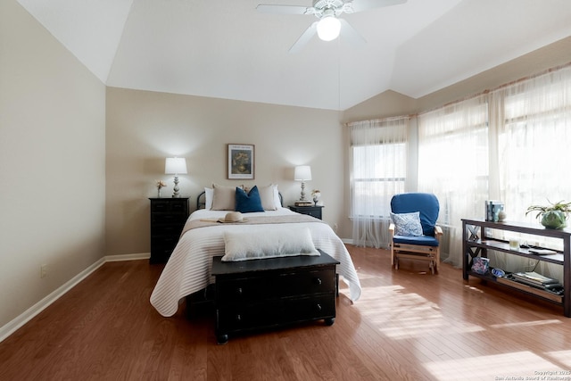 bedroom featuring lofted ceiling, hardwood / wood-style flooring, and ceiling fan