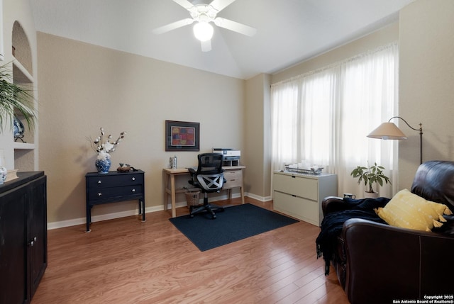 office area with vaulted ceiling, ceiling fan, and light wood-type flooring