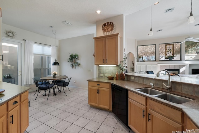 kitchen featuring light tile patterned flooring, sink, tasteful backsplash, decorative light fixtures, and dishwasher