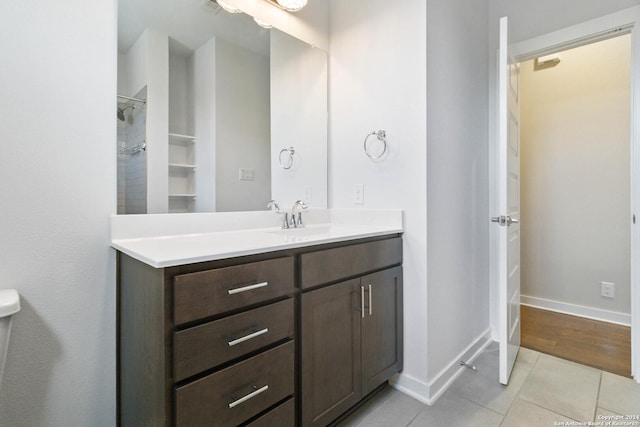 bathroom with tile patterned flooring and vanity