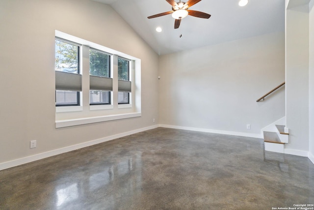 empty room with high vaulted ceiling and ceiling fan