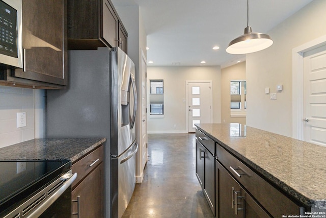 kitchen with tasteful backsplash, a center island, stainless steel fridge with ice dispenser, stone counters, and pendant lighting