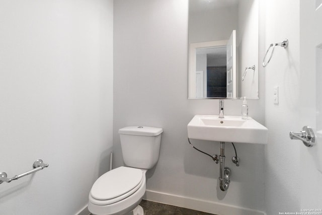 bathroom with sink and toilet