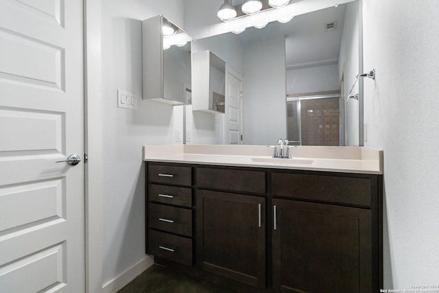 bathroom with vanity and an enclosed shower