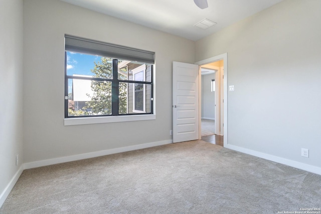 unfurnished bedroom featuring ceiling fan and carpet