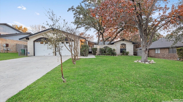 single story home featuring a garage and a front lawn