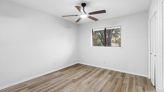 unfurnished bedroom with light hardwood / wood-style flooring, a closet, and ceiling fan