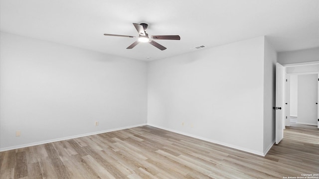 unfurnished room with ceiling fan and light wood-type flooring