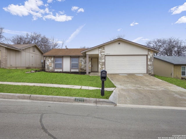 ranch-style home featuring a garage and a front yard