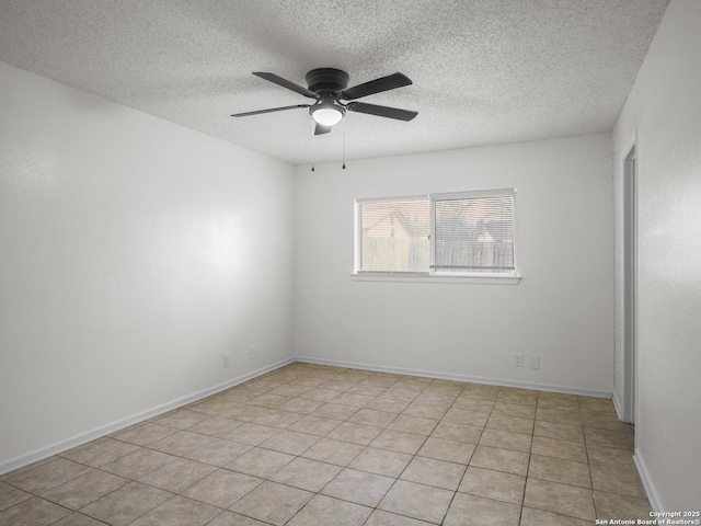 unfurnished room featuring light tile patterned floors, a textured ceiling, and ceiling fan